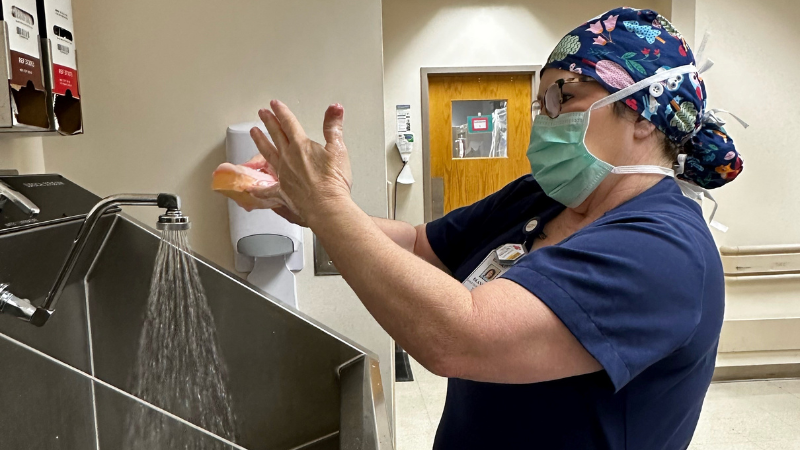 A surgical tech scrubs in for a surgery at EAMC. 