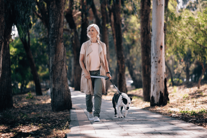 Woman walking with dog