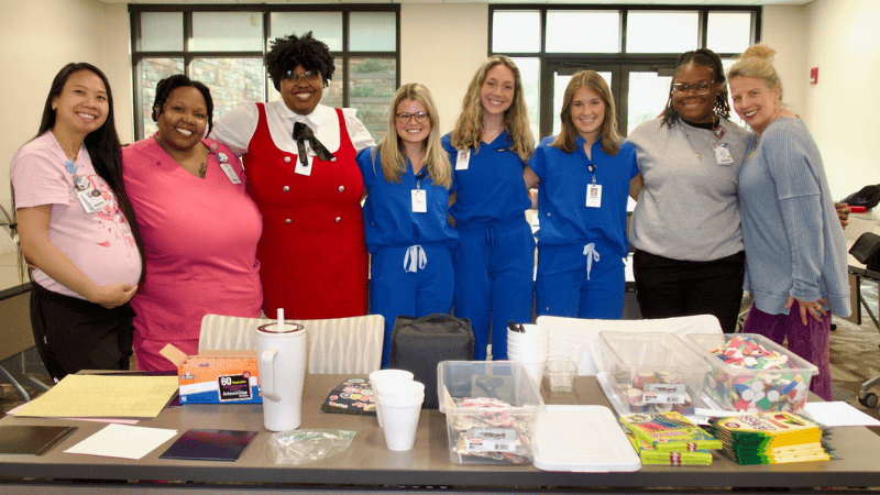 Instructors pose for a photo during an Art Therapy session at the Spencer Cancer Center