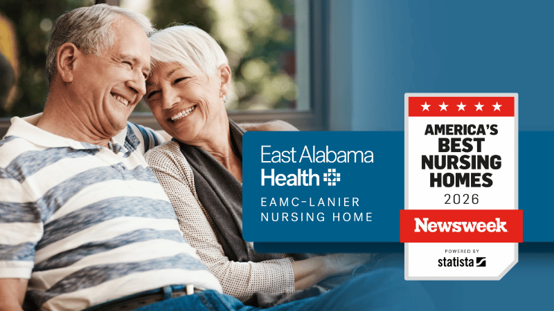 An elderly couple with the East Alabama Health - EAMC-Lanier Nursing Home and Newsweek 2026 emblAn elderly couple with the East Alabama Health - EAMC-Lanier Nursing Home and Newsweek 2026 emblem to the right.em to the right.