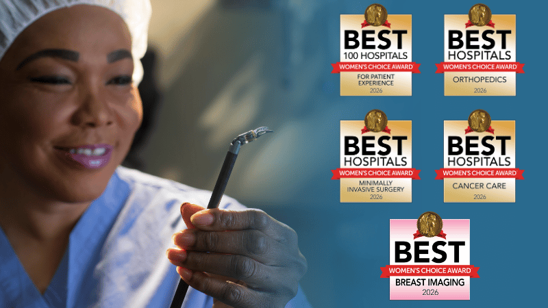 A physician posing for a photo with five 2026 Women's Choice Award seals to the right.  