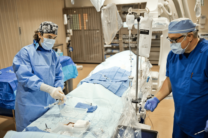 Surgeons at East Alabama Health prepping a room for surgery.
