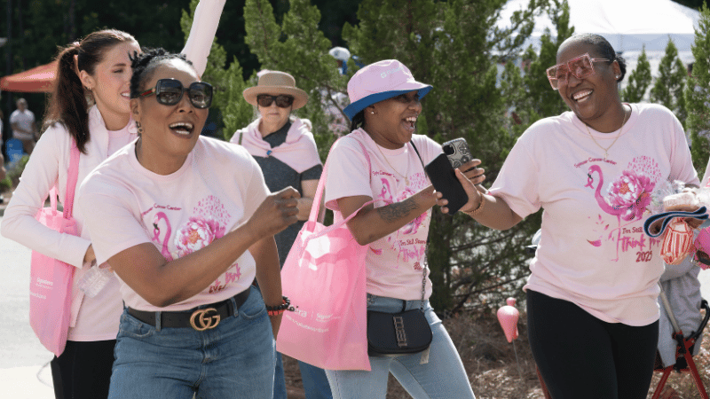 Attendees celebrate during a Think Pink event held at Spencer Cancer Center.